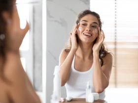 Applying facial moisturizer